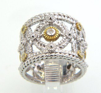Judith Ripka Silver/18K Gold and Diamond Ring: Judith Ripka Silver/18K Gold and Diamond Ring.The total ring weight is 8.9 grams.The total weight of diamond: 0.14 cts. I color SI clarity.The ring is 15 mm wide and 1 mm in thickness.The size of ring
