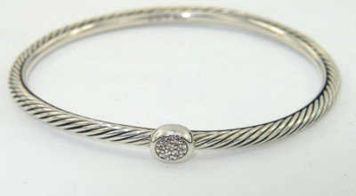 David Yurman Silver Diamond Bangle: David Yurman Silver Diamond Bangle.The total Bangle 's weight is 11.3 grams.The total diamond weight is 0.07 cts approxmiately. I color SI clarity.The bangle size is 48 x 48 mm. 2 mm in thickness.