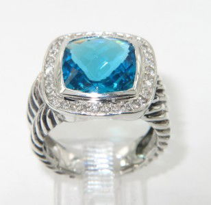 David Yurman Silver Blue Topaz & Diamond Ring: David Yurman Silver Blue Topaz & Diamond Ring.The total ring's weight is 7.9 grams.The total weight of the diamond is 0.49 cts approximately, H - I color SI clarity.The size of the Blue Topaz is 9 x 9