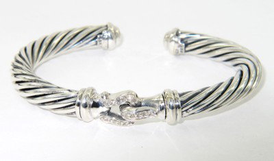 David Yurman Silver Diamond Bangle: David Yurman Silver Diamond Bangle.The total Bangle's weight is 37.6 grams.The total diamond weight is 0.72 cts approximately, I color SI clarity.The bangle size is 50 x 34 mm. 5 mm in thickness.