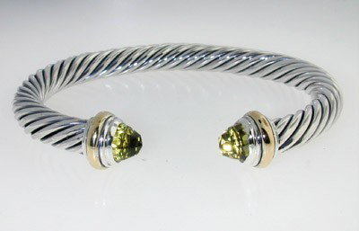 David Yurman Silver, 14K Gold, Lemon Citrine Bangl: David Yurman Silver, 14K Yellow Gold, Lemon Citrine Bangle.The total Bangle's weight is 39.8 grams.The size of Lemon Citrine: 6 mm.The measurement of the inside bangle is 56 x 44 mm, Thickness: 6 mm.