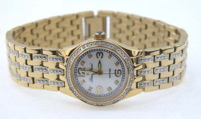 Lucien Piccard Stainless Steel Ladies' Watch: Lucien Piccard Stainless Steel, Mother of Pearl, Sapphire Crystal Ladies' Watch With Box.The total watch's weight is 67.4 grams.The measurements of the watch head is 25 mm in diameter and 9 mm in thic