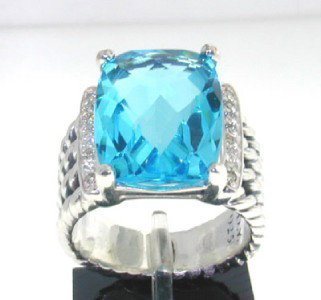 David Yurman Silver, Blue Topaz & Diamond Ring: David Yurman Silver, Blue Topaz & Diamond Ring.The total ring's weight is 9.2 grams.The total diamond weight is 0.25 ct ,approxmiately. I color SI clarity.The size of Blue Topaz is 15x10 mm.The size o