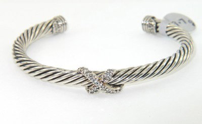 David Yurman Silver Diamond Bangle: David Yurman Silver Diamond Bangle.The total Bangle 's weight is19.7 grams.The total diamond weight is 0.15 cts approxmiately. I color SI clarity.The bangle size is 53 x 45 mm. 5 mm in thickness.