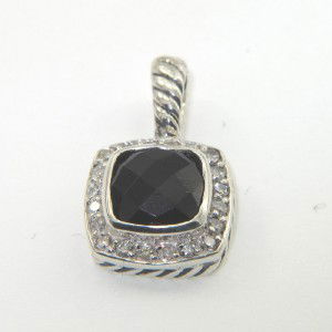 David Yurman Silver Onyx & Diamond Pendant: David Yurman Silver Onyx & Diamond Pendant.The total Pendant's weight is 2.7 grams.The total weight of diamonds is 0.24 cts. approximately I and SI clarity.The size of the onyx is 7 mm in diameter.The