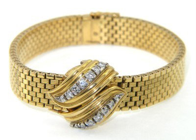 Black Starr & Oorlam 18K Yellow Gold Diamon: Black Starr & Oorlam 18K Yellow Gold Diamond Cover Watch.The total watch's weight is 48.2 grams.The total weight of diamond: 0.7 cts. H color VS clarity.The size of watch head: 10 x 10 mm and 6 mm thi