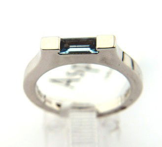 Asprey 18K White Gold, Blue Topaz Ring.: Asprey 18K White Gold, Blue Topaz Ring. The total Ring's weight is 4.8 grams. The size of blue topaz: 2 x 4 mm Ring size is 5.25