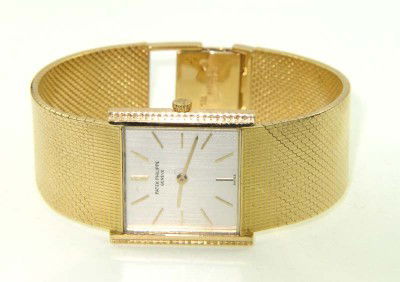 Patek Philippe 18K Yellow Gold Wrist Watch: Patek Philippe 18K Yellow Gold Wrist Watch.The total watch's weight is 84.3 grams.The measurements of watch head is 20 x 25 mm and 4 mm thick.The length of watch: 6.75".swiss made.Water Resistant.Chai