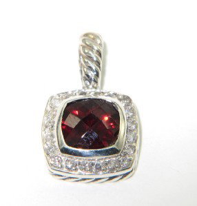 David Yurman Silver Garnet & Diamond Pendant: David Yurman Silver Garnet & Diamond Pendant.The total Pendant's weight is 2.9 grams.The total weight of diamonds is 0.24 cts. approximately I and SI clarity.The size of the Blue Topaz is 7 x 7 mm.The