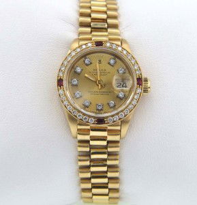 Rolex 18K Yellow Gold Diamond/Ruby Watch: Rolex 18K Yellow Gold Diamond/Ruby Oyster Perpetual DateJust, Sapphire Crystal Watch.The total watch's weight is 65.3 grams.The total weight of diamond: 1.05 cts. H color VS - SI clarity.The total wei