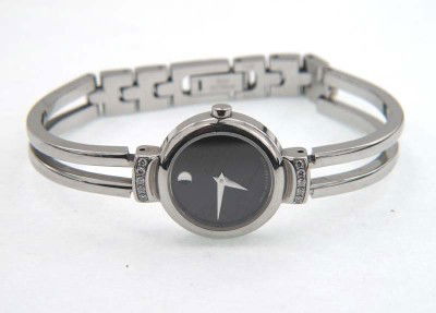 Movado Stainless Steel Diamonds Watch: Movado Stainless Steel Diamonds Watch.The total watch's weight is 32.9 grams.The total weight of diamond: 0.2 cts. H color SI clarity.The measurements of the watch head is 17 x 22 mm and 4 mm thick.Th