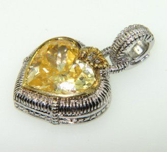 Judith Ripka Silver/18K Gold,Citrine,Diamond: Judith Ripka Silver/ 18K Yellow Gold, Citrine & Diamond Pendant.The weight of the Pendant is 14.3 grams.The size of the Citrine is 15 mm.The total weight of diamond: 0.09 pts. I color SI clarity.The s