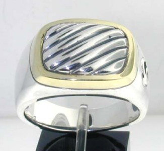 David Yurman Silver & 14K Yellow Gold Ring: David Yurman Silver & 14K Yellow Gold Ring.The total ring's weight is 17 grams.The measurement of ring's face: 18 x 13 mm and 4 mm in thickness.The size of the ring is 12.25