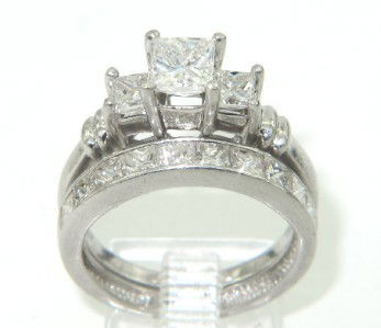 Platinum Diamond Lady's Wedding Ring Set: Platinum Diamond Lady's Wedding Ring Set.The ring's weight is 8.2 grams.Shape: Princess cut measurement: 16 x 6 x 9 mm.The total weight of Centered Diamond is approximately 0.85 cts. H color VS clarit