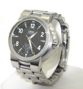 Oris Stainless Steel Skeleton Watch: Oris Stainless Steel Sapphire Crystal Skeleton Watch.Watch's Weight: 160.4 grams.The measurements of watch head: 37 x 37 mm and 11 mm in thickness.The length of watch: 9.5".Chain is 22 mm wide.Water R
