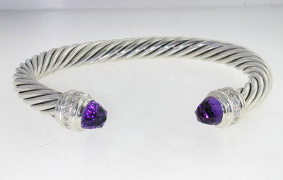 David Yurman Silver Amethyst Diamond Bangle: David Yurman Amethyst & Diamond Bangle in Silver.The total Bangle's weight is 44.3 grams.The total diamond weight is 30 pts approxmiately, H color VS clarity.The size of the Amethyst is 7 x 7 mm, each