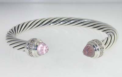 David Yurman Silver Pink Quartz & Diamond Bangle.: David Yurman Silver Pink Quartz & Diamond Bangle.The total Bangle's weight is 39.9 grams.The total diamond weight is 0.32 ct. approxmiately, H-I color SI1 clarity.The size of Pink Quartz: 8 mm.The mea