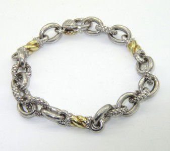 Judith Ripka 18K Yellow Gold/Silver Bracelet: Judith Ripka 18K Yellow Gold / Silver Bracelet.The total weight of Bracelet is 25.9 grams.The measurement of bracelet: 7.25" long and 7 mm in wide