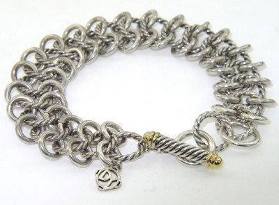 David Yurman Silver/18K Yellow Gold Bracelet: David Yurman Silver/18K Yellow Gold Bracelet The total bracelet 's weight is 46.2 grams. The length of bracelet: 8.5" The bracelet is 16 mm wide and 1 mm in thickness