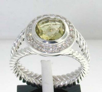 David Yurman Silver Lemon Citrine Diamond Ring: David Yurman Silver Lemon Citrine Diamond Ring.The total ring's weight is 6.3 grams.The total weight of the diamond is 0.28 cts approximately, H color VS clarity.The size of the Lemon Citrine is 8x8 m