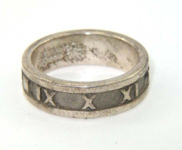 Tiffany & Co Silver Ring: Tiffany & Co Silver Ring.The total earring's weight is 5.6 grams.The size of ring: 6.75.The ring is 5 mm wide and 1 mm in thickness