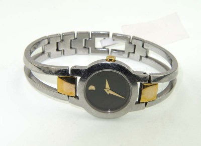 Movado Stainless Steel & Gold Plated Watch: Movado Stainless Steel & Gold Plated Watch.The total watch's weight is 35.2 grams.The measurements of the watch head is 17 x 23 mm and 4 mm thick.The length of watch: 6".Swiss Made.Water Resistant.Cha