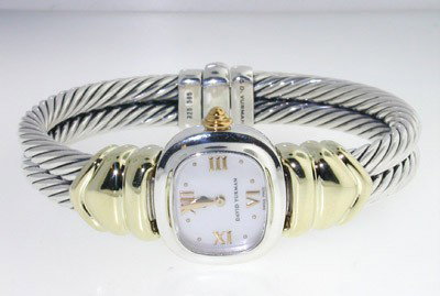 David Yurman 14K Yellow Gold and Silver Watch: David Yurman 14K Yellow Gold and Silver Watch watch's Weight: 60.2 grams. The measurement of watch's head: 9 x 20 and 8 mm in thickness The measurements of the Inside watch's Bangle is 48 x 36 mm and 