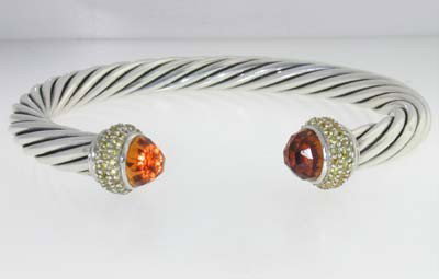 David Yurman Silver, Citrine & Yellow Sapphire Ba: David Yurman Silver, Citrine & Yellow Sapphire Bangle. The total Bangle's weight is 31.8 grams. The total Yellow Sapphire weight is 1 cts The size of citrine: 6 mm The measurement of the inside bangle