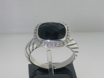 David Yurman Silver, Onyx & Diamond Ring: David Yurman Silver, Onyx & Diamond Ring The total ring's weight is 4.6 grams. The total weight of the diamond is 0.24 cts approximately, I color SI clarity. The size of the Onyx is 10 x 8 mm. The mea