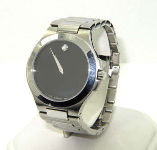 Movado Stainless Steel Watch: Movado Stainless Steel Watch With Extra Link.The total watch's weight is 135.6 grams.The measurements of the watch head is 30 x 39 mm and 7 mm thick.The length of watch: 7.75".Swiss Made.Water Resista