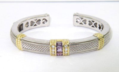 Judith Ripka Silver/18K Yellow Gold Amethyst Bangl: Judith Ripka Silver/18K Yellow Gold Amethyst Bangle With Pouch.The total weight of Bangle is 37.8 grams.The total weight of amethyst is 0.55 cts. approximately.The size of Bangle is 49 x 41mm, the sur