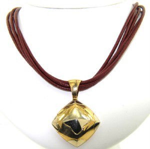 Bvlgari 18K Yellow Gold Leather Cord Pendant: Bvlgari 18K Yellow Gold Leather Cord Pendant Necklace.The total weight of Necklace is 27.4 grams.The size of pendant: 43 x 29 mm and 4 mm in thickness.The Necklace is 14.5" long.