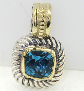 David Yurman Silver & 18K Gold Blue Topaz Pendant: David Yurman Silver & 18K Gold Blue Topaz Pendant The weight of the Pendant is 5.3 grams The size of the blue topaz is 7 x 7 mm The measurement of pendant is 20 x 12 mm and 4 mm in thickness There is