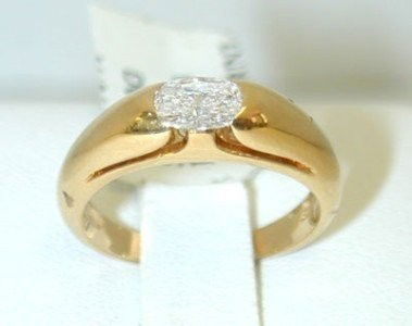 Bvlgari 18K Yellow Gold Diamond Ring: Bvlgari 18K Yellow Gold Diamond Ring.The total ring's weight is 4.9 grams.The total weight of the diamonds are 0.30 cts. approximately, G color VS clarity.The size of the ring is 5.5".The measurement