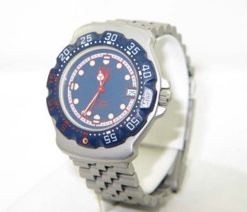 Tag Heuer DateJust Stainless Steel / Titanium Watch: Tag Heuer DateJust Stainless Steel / Titanium Watch. The total watch's weight is 72.4 grams. The size of watch head: 33 x 40 mm and 8 mm thick The length of the watch is 7" Swiss Made Water Resistant