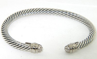 David Yurman Silver Diamond Bangle: David Yurman Silver Diamond Bangle Bangle's Weight: 28.4 grams The weight of diamond: 0.2 cts, I color, VS - SI clarity The measurements of the Inside Bangle is 52 x 42 mm and the thickness is 4 mm Th