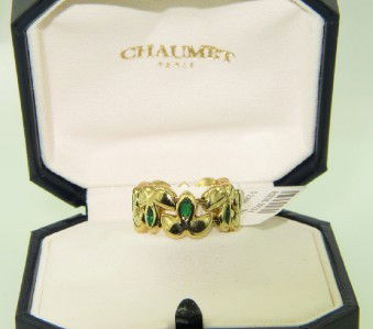 Chaumet Paris 18K Yellow Gold Emerald Ring: Chaumet Paris 18K Yellow Gold Emerald Ring With Box The total ring weight is 10 grams. The total weight of emerald: 0.48 cts The ring size is 6.5 The width of ring is 8 mm There are "Chaumet Paris and