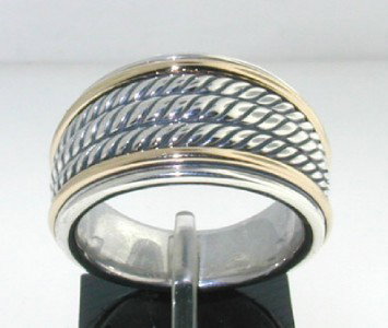 David Yurman Silver, 18K Yellow Gold Ring: David Yurman Silver,18K Yellow Gold Ring. The total ring's weight is 15 grams. The size of the ring is 7