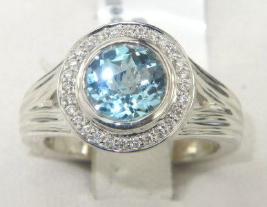 Charles Krypell 14K Gold/Silver Blue topaz Diamond: Charles Krypell 14K Gold/Silver Blue topaz and Diamond Ring The total ring's weight is 6.9 grams. The total weight of diamond 0.15 cts. H color VS clarity The size of the blue topaz is 7 x 7 mm. The s