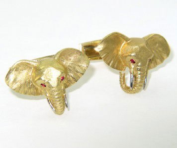 18K Yellow Gold, Ruby Elephant Cufflinks: 18K Yellow Gold, Ruby Elephant Cufflinks.The total weight of Cufflinks: 20.3 grams. The total weight of ruby is 0.05 pts. approximately. The size of the Cufflinks face: 15 x 22 mm