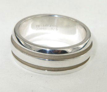 Tiffany & Co. Silver Ring: Tiffany & Co. Silver Ring Ring's Weight: 11.9 grams The Ring's size is 11 The measeurements of the ring is 8 mm wide and 1 mm thick