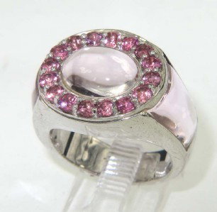 Silver Pink Topaz Ring: Silver Pink Topaz Ring The total ring's weight is 12.1 grams The size of pink topaz: 8 x 6 mm - 10 x 6 mm - 1 mm The measurement of rings' surface: 17 x 14 mm and 6 mm in thickness The size of the rin