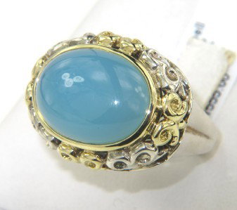 Charles Krypell Gold/Silver Chalcedony Ring: Charles Krypell 18K Gold/Silver Chalcedony Ring The total ring's weight is 14.2 grams. The size of the Chalacedony is 16 x 11 mm. The measurement of ring's surface is 22 x 17 mm and 10 mm thick. The s