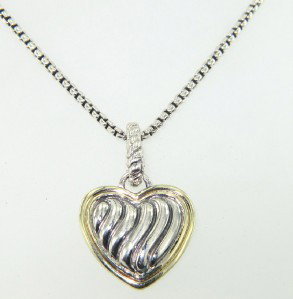 David Yurman Silver/18K Yellow Gold Necklace.: David Yurman Silver/18K Yellow Gold Necklace. The total weight of Necklace is 13.6 grams. The size of the pendant is 18 x 16 mm. The length of the necklace is 17.5" inches long.