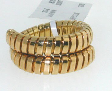 BVLGARI 18K Yellow Gold Ring: BVLGARI 18K Yellow Gold Ring The total band weight is 10.1 grams The width of the bend is 5 to 10 mm The size of the ring is 7.25