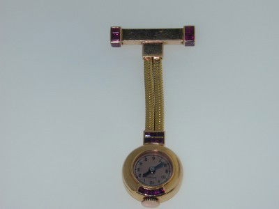 Boucheron 18K Gold Ruby Watch Brooches from 1: Boucheron 18K Yellow Gold Ruby Watch Brooches from 1930. The total weight of Brooches is 17.0 grams. Total wieght of (Invisible Set) 23 ruby: 1.0 cts. The measurements of the brooches are 2.25" long a