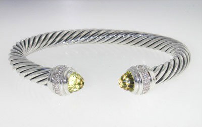 David Yurman Silver,Lemon Citrine & Diamond Bangle.: David Yurman Silver, Lemon Citrine & Diamond Bangle.The total Bangle's weight is 41.1 grams.The total diamond weight: 0.48 cts. H color SI clarity.The size of Lemon Citrine: 6 mm.The measurement of th