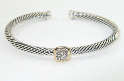 David Yurman Silver 18K Yellow Gold Diamond Bangl: David Yurman Silver & 18K Yellow Gold Diamond Bangle The total Bangle 's weight is 19.8 grams. The total diamond weight is 0.09 cts approxmiately. I color SI clarity The bangle size is 55 x 45 mm. 4 m
