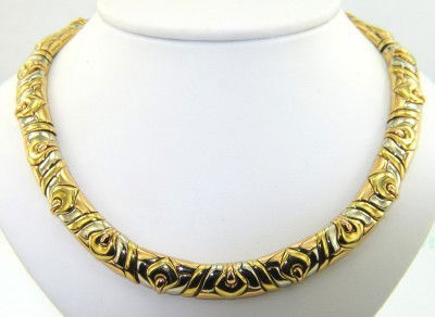 Bvlgari 18K 2-Toned Gold Necklace: Bvlgari 18K 2- toned (Yellow and White) Gold Necklace. Weight of Necklace: 127.3 grams. The length of Necklace: 13" , 9 mm wide, 3 mm thick. There is the Bvlgari stamp and 750 on the necklace.