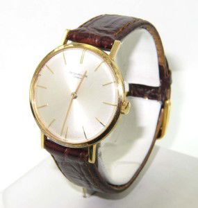 Patek Philippe 18K Yellow Gold Leather Strap Watch: Patek Philippe 18K Yellow Gold Leather Strap Watch The total watch's weight is 32.8 grams. The measurements of watch head is 32 x 32 mm and 5 mm thick. Dial: Gold Stick dial Movement: Manual The lengt